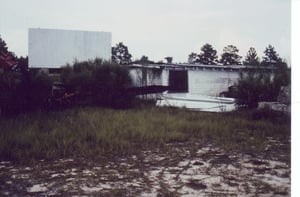 Projection/concession building partially
hidden behind bushes