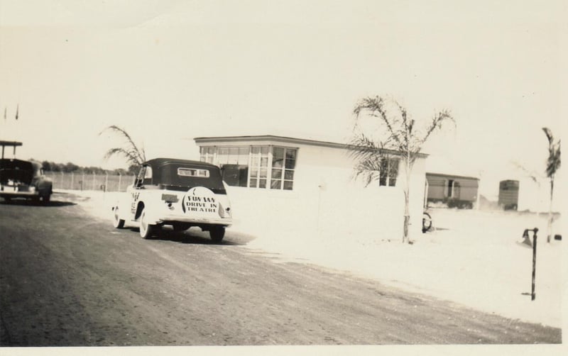 Photo taken of the front entrance, with the drive in car.  Name on back.