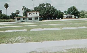 The snack bar from the old drive-in, with the chapel next to it and some old ramps visible in the foreground, Havendale Drive-In.