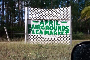 Sign indicating where the flea market relocation site is.