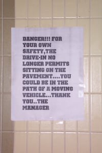 Sign posted on snack bar wall.