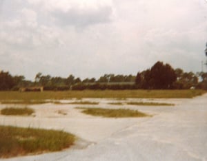 The parking lot at the No. 1 Drive-In. This was taken around two or three years after the theatre closed. Image from 1979.