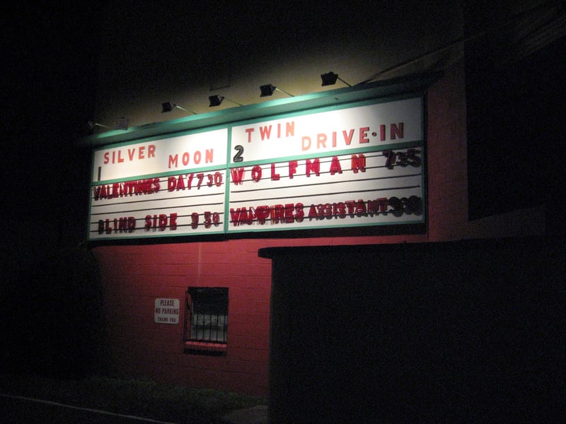 MOVIE TITLE BOARD ON THE SCREEN BACK AS YOU ENTERTHE THEATER.