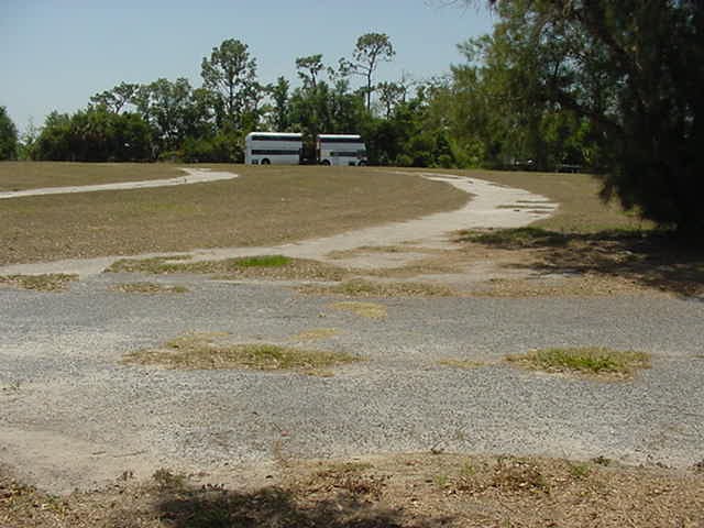 May 5 2006. The half circle pavement is where u drove 2 get your car up onto the higher land so the front end of your car was hi. The grass is brown rite now.
