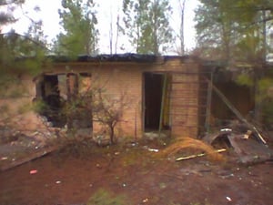 A very deteriorated concession stand(or possibly the projection house)