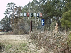 Closer to the entrance sign, some letters are shown on the marquee.