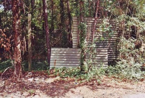 Remaining sheet metal fence next to ticket booth location (compare with black and white picture of box office)