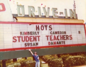 Photo of me Tommy Holcombe standing with the marquee at the Glenwood Drive-In from 1979.