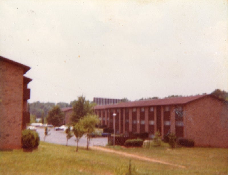 Part of the back of the Glenwood Drive-In's screen that's visible above an apartment building next to the theatre. Photo from 1979.