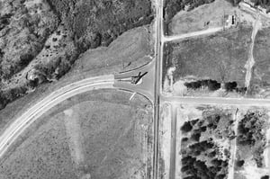 Aerial view showing the marquee and the entrance and exit roads at the Glenwood Drive-In from 1957. Photo from the Georgia Department Of Transportation.