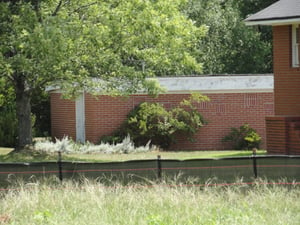 old projectionconcession building is some sort of storage behind church on site