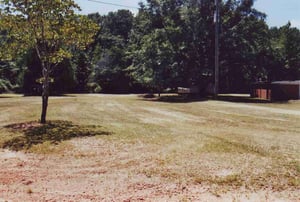 Field with ramps behind concession building