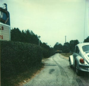 Entrance road going into Lake Lanier Drive-In. Image is from 1978.