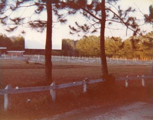 The parking lot and screen at the Lake Lanier Drive-In. Photo from the late 70's.