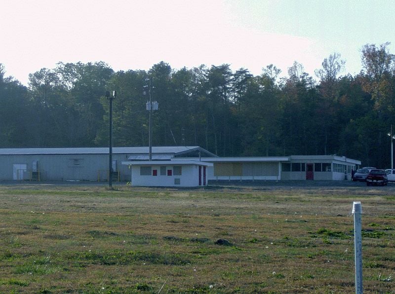 This is the DI as it looks today. The projection building is in the forefront, the concession stand is to the right where the vehicles are parked. The attached building is actually sided with metal left over from the screen that was storm damaged and had