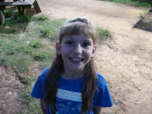 Adorable little girl manning the entrance to the Starry Night D-I in Fort Valley, Georgia.