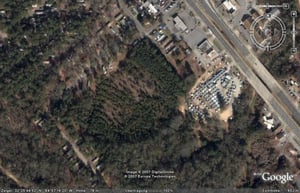 Aerial view of former drive-in, heavily overgrown