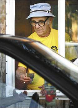 Lewis Radosevich, 83, sells tickets at Sunshine Mine Drive-In. Tickets are $6 per person and free for kids age 12 and younger.