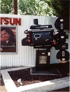 1950 water cooled, carbon-arc projector on dispaly beside the marquee just outside the main entrance.