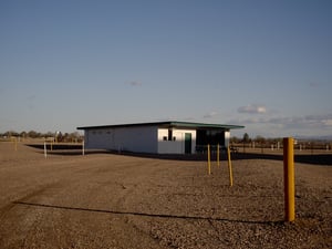 Long shot across field of snack bar/projection booth.