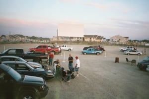 screen and field with cars