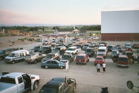 screen and field with cars during daylight