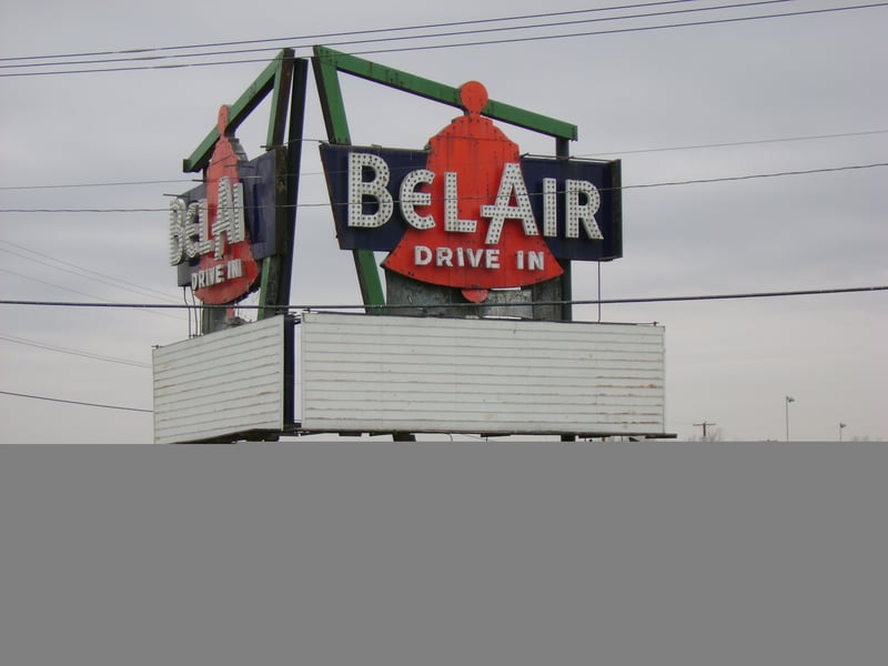 The remarkably well-preserved marquee for the Bel-Air Drive-In sits across the street from a Hen House eatery.  Nothing remains of the facility, but the lot is for sale!