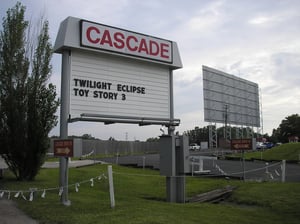 Cascade Drive-In sign, entrance, and screen.