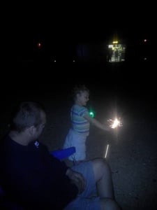 Our LO  my hubby having some fun with sparklers in between the movies at the drive in