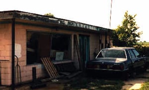 Another abandoned vehicle. You would never guess that this theatre is open and operating.