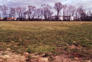 Open field behind businesses