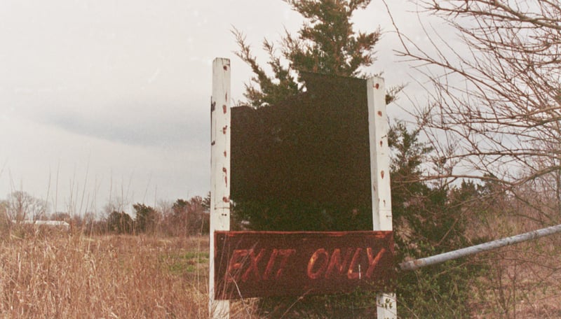 Old Exit sign, Widescreen Drive-In Theatre. The theatre used to show Dusk to Dawn Marathons' about once each month. There would be about six feature films shown throughout the night. Come When You Can -Leave When You Must was slogan in newspaper adverti