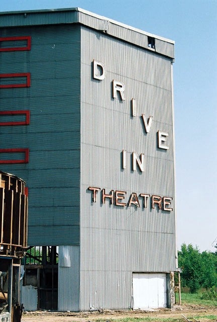 This is the right side from the front, notice the Cool DRIVE-IN THEATRE neon lettering. They tore all of it down with the screen. Very sad.