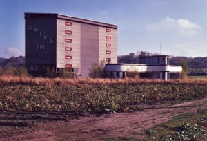 Picture of the screen tower and ticket booths from the access road