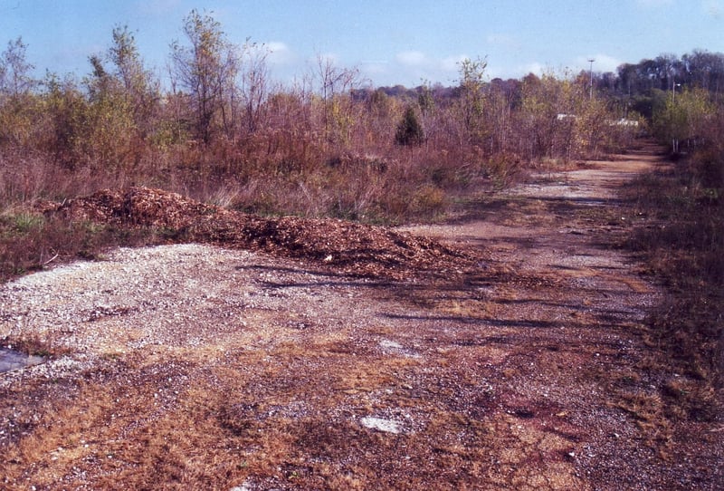 Area behind the ticket booths. A cluster of speaker poles can be seen in the distance on the right