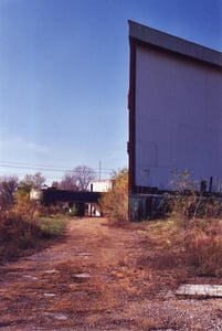 Looking back at the screen and ticket booths