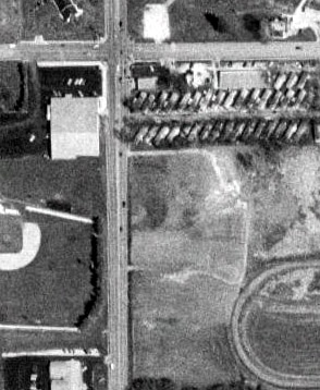 satellite photo; taken May 5, 1995; the lot to the right of the road