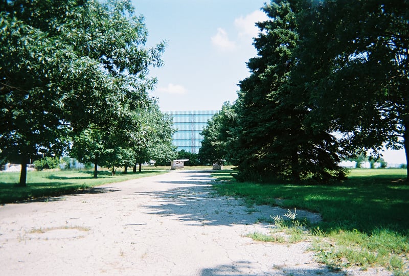 The road leading in with ticket booths and screen in the distance.