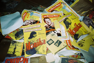 Old movie handbills strewn about in the screen tower.
