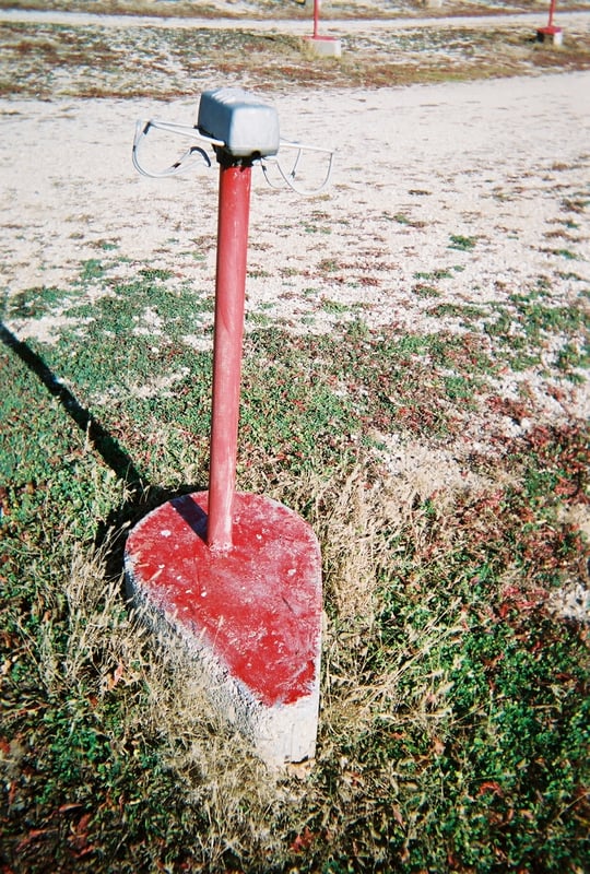 Poles with red bases are for trucks to park next to...