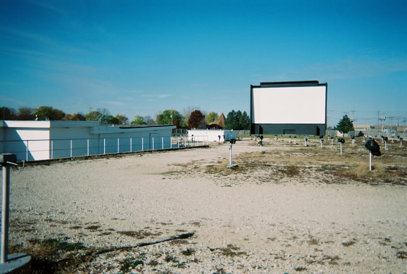 Long, low concession building and projection building facing the screen.