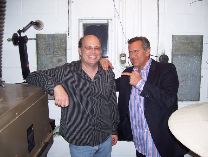Midway Drive-In owner Mike Kerz with Film and TV star Bruce Campbell. Bruce Campbell appeared live at the Midway Drive-In for a film festival in September 2010. The Midway Drive-In is located in Dixon, Illinois.
