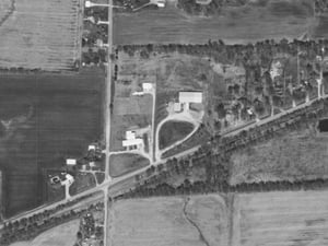 Southwest of town along Waltonville Road, you can hardly tell it was once a drive-in but the three partial ramps visible towards the back reveal its past. Looks like the concession building may remain but a newer pole barn-looking building is standing nex