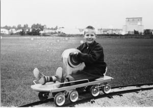 The River Lane screen tower can be seen behind this youngster who was enjoying a ride at the Kiddieland Amusement park, which bordered the theater.  Kiddieland was in operation from 1950-1977 on Forest Hills Rd. in Loves Park, IL.
