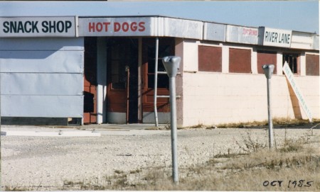 A view of the boarded up concession stand of the River Lane Outdoor Theater, after its closing in the Fall of 1984, taken in October, 1985.