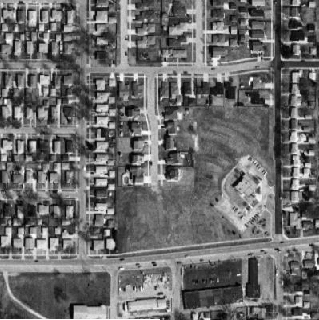 Terraserver photo of the former site of the Sauk Trail Drive-In. Note the ramps still visible more than 20 years after the Sauk Trail's demolition. The ramps would have extended in a full arc across the upper left area of the property, where houses now st