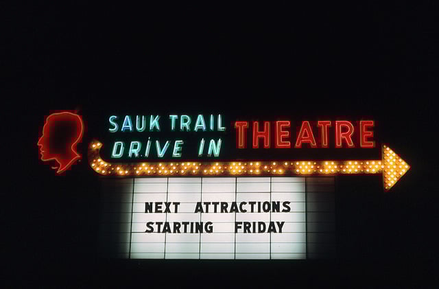 According to one source, the Sauk Trail Drive-In accommodated 830 cars. It opened in 1955 and was closed in 1977. Housing is now on the site.