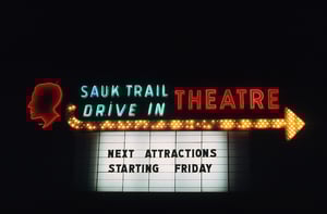 According to one source, the Sauk Trail Drive-In accommodated 830 cars. It opened in 1955 and was closed in 1977. Housing is now on the site.