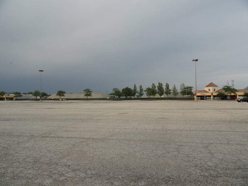 Former site now a parking lot and strip mall