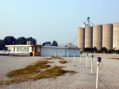 Speaker poles with snackbar and projection building in the background